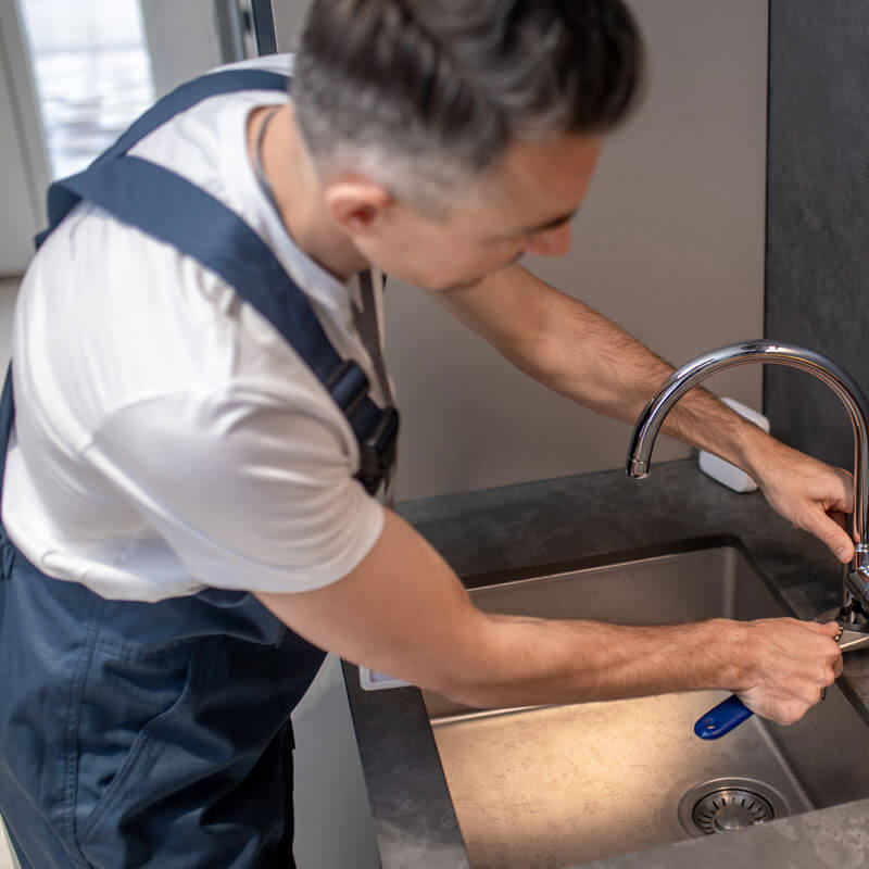 Plumber installing a boiling water tap in London